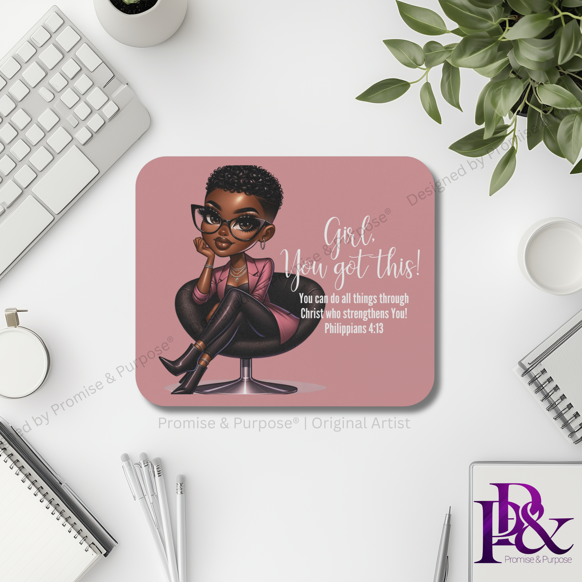Mouse pad with a motivational quote and illustration of a woman on a desk setup.